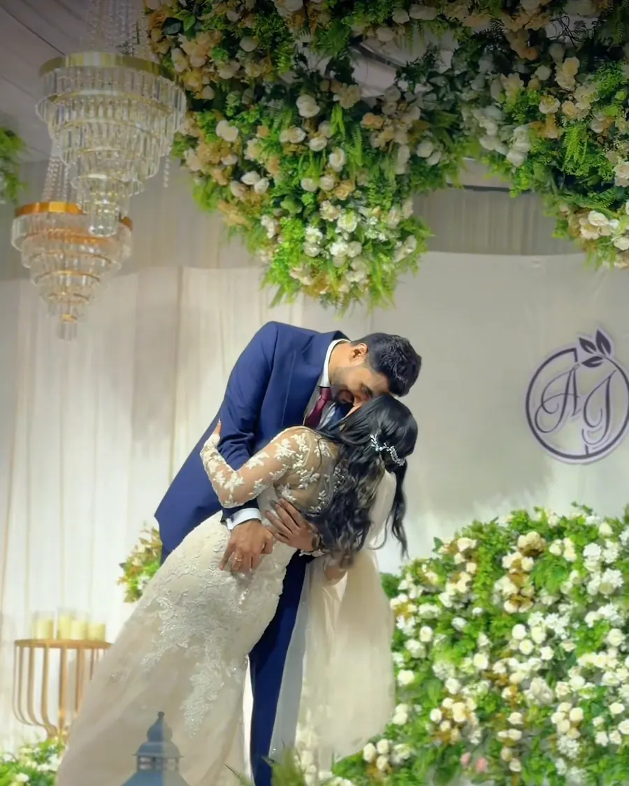 The couple on the floral stage